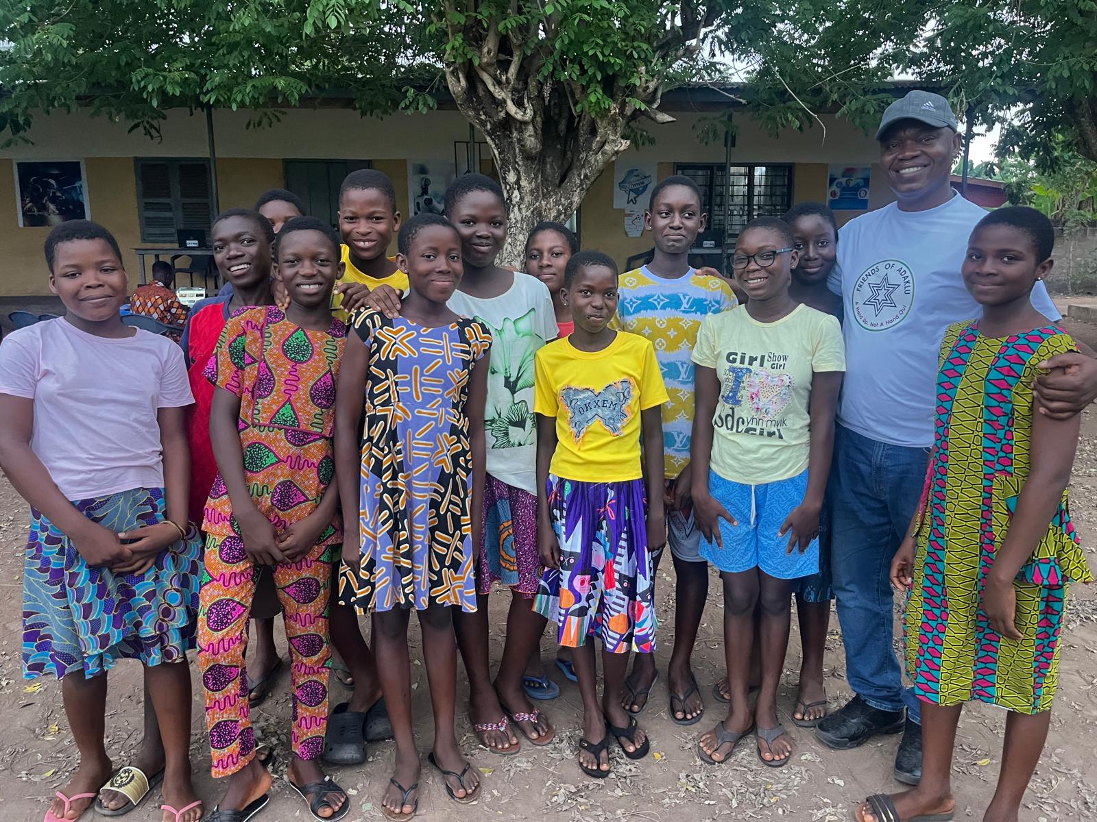A group of students and a Friends of Adaklu partner at the Adaklu Kodzobi community pilot
